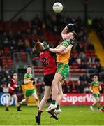 23 April 2023; Darragh Saul of Down in action against Darragh Hennigan of Donegal during the Ulster GAA Football Minor Championship Group A match between Down and Donegal at Pairc Esler in Newry, Down. Photo by Ramsey Cardy/Sportsfile