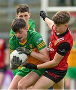 23 April 2023; Jordi Gribben of Donegal in action against Daniel McMahon of Down during the Ulster GAA Football Minor Championship Group A match between Down and Donegal at Pairc Esler in Newry, Down. Photo by Ramsey Cardy/Sportsfile
