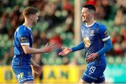 24 April 2023; Ronan Coughlan of Waterford, right, celebrates after scoring his side's second goal with teammate Barry Baggley during the SSE Airtricity Men's First Division match between Treaty United and Waterford at Markets Field in Limerick. Photo by Michael P Ryan/Sportsfile