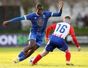 24 April 2023; Tunmise Sobowale of Waterford in action against William Armshaw of Treaty United during the SSE Airtricity Men's First Division match between Treaty United and Waterford at Markets Field in Limerick. Photo by Michael P Ryan/Sportsfile