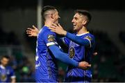 24 April 2023; Ronan Coughlan of Waterford, left, celebrates with teammate Dean McMenamy after scoring his third and their side's fourth goal during the SSE Airtricity Men's First Division match between Treaty United and Waterford at Markets Field in Limerick. Photo by Michael P Ryan/Sportsfile
