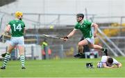 23 April 2023; Stephen Bennett of Waterford lies on the ground following a challenge from Seamus Flanagan of Limerick, 14, as Darragh O'Donovan of Limerick hurls on, during the Munster GAA Hurling Senior Championship Round 1 match between Waterford and Limerick at FBD Semple Stadium in Thurles, Tipperary. Photo by Stephen McCarthy/Sportsfile