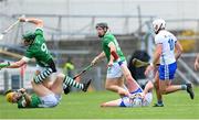 23 April 2023; Stephen Bennett of Waterford holds his head following a challenge from Seamus Flanagan of Limerick, yellow helment, during the Munster GAA Hurling Senior Championship Round 1 match between Waterford and Limerick at FBD Semple Stadium in Thurles, Tipperary. Photo by Stephen McCarthy/Sportsfile