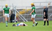 23 April 2023; Stephen Bennett of Waterford holds his head following a challenge from Seamus Flanagan of Limerick, left, during the Munster GAA Hurling Senior Championship Round 1 match between Waterford and Limerick at FBD Semple Stadium in Thurles, Tipperary. Photo by Stephen McCarthy/Sportsfile