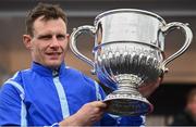 25 April 2023; Jockey Paul Townend with the trophy after riding Energumene to win the William Hill Champion Steeplechase during day one of the Punchestown Festival at Punchestown Racecourse in Kildare. Photo by Harry Murphy/Sportsfile