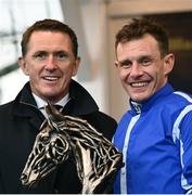 25 April 2023; Jockey Paul Townend is presented the winning jockey trophy by former jockey AP McCoy after winning the William Hill Champion Steeplechase during day one of the Punchestown Festival at Punchestown Racecourse in Kildare. Photo by Harry Murphy/Sportsfile