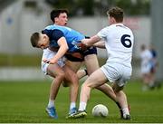 25 April 2023; Michael McDonald of Dublin is tackled by Jack McKevitt, left, and James McGrath of Kildare during the 2023 EirGrid Leinster U20 Football Championship Final between Dublin and Kildare at Netwatch Cullen Park, Carlow. Photo by Eóin Noonan/Sportsfile