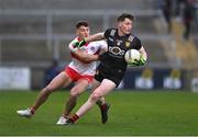 26 April 2023; Odhran Murdock of Down in action against Dan Higgins of Derry during the 2023 EirGrid Ulster U20 Football Championship Final match between Derry and Down at BOX-IT Athletic Grounds in Armagh. Photo by Ben McShane/Sportsfile