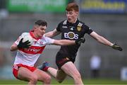 26 April 2023; Patrucj McGurk of Derry in action against Finn Murdock of Down during the 2023 EirGrid Ulster U20 Football Championship Final match between Derry and Down at BOX-IT Athletic Grounds in Armagh. Photo by Ben McShane/Sportsfile