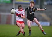 26 April 2023; Patrucj McGurk of Derry in action against Finn Murdock of Down during the 2023 EirGrid Ulster U20 Football Championship Final match between Derry and Down at BOX-IT Athletic Grounds in Armagh. Photo by Ben McShane/Sportsfile