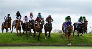 27 April 2023; Runners and riders, including eventual winner Vital Island, second from right, with Benny Walsh up, jump Ruby's Double during the Mongey Communications La Touche Cup Cross Country Steeplechase on day three of the Punchestown Festival at Punchestown Racecourse in Kildare. Photo by Seb Daly/Sportsfile