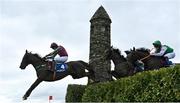 27 April 2023; Michael's Pick, left, with Eoin Walsh up, jumps the Glendalough Drop during the Mongey Communications La Touche Cup Cross Country Steeplechase on day three of the Punchestown Festival at Punchestown Racecourse in Kildare. Photo by Seb Daly/Sportsfile