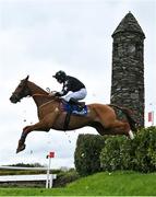 27 April 2023; Blast Of Koeman, with Philip Enright up, jumps the Glendalough Drop during the Mongey Communications La Touche Cup Cross Country Steeplechase on day three of the Punchestown Festival at Punchestown Racecourse in Kildare. Photo by Seb Daly/Sportsfile