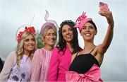 28 April 2023; Racegoers, from right, Sarah McDermott, from Newbridge, Ruth McCabe, from Allen, AnnMarie Dunning, from Newbridge, and Gráinne Carr, from Ardclough, Kildare, pose for a selfie during day four of the Punchestown Festival at Punchestown Racecourse in Kildare. Photo by Seb Daly/Sportsfile