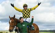 28 April 2023; Jockey Paul Townend celebrates on State Man, with groom Rachel Robbins, after winning the Alanna Homes Champion Novice Hurdle during day four of the Punchestown Festival at Punchestown Racecourse in Kildare. Photo by Seb Daly/Sportsfile