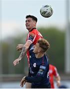 28 April 2023; Cian Kavanagh of Derry City in action against Sam Curtis of St Patrick's Athletic during the SSE Airtricity Men's Premier Division match between Derry City and St Patrick's Athletic at The Ryan McBride Brandywell Stadium in Derry. Photo by Ramsey Cardy/Sportsfile