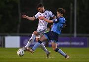 28 April 2023; Krystian Nowak of Bohemians in action against Danú Bishop Kinsella of UCD during the SSE Airtricity Men's Premier Division match between UCD and Bohemians at the UCD Bowl in Dublin. Photo by Ben McShane/Sportsfile