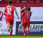 28 April 2023; Matty Smith of Shelbourne, 11, celebrates with teammate Tyreke Wilson after scoring his side's first goal during the SSE Airtricity Men's Premier Division match between Shelbourne and Cork City at Tolka Park in Dublin. Photo by Harry Murphy/Sportsfile