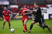 28 April 2023; Matty Smith of Shelbourne in action against Ally Gilchrist of Cork City during the SSE Airtricity Men's Premier Division match between Shelbourne and Cork City at Tolka Park in Dublin. Photo by Harry Murphy/Sportsfile