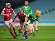 28 April 2023; Fintan Fitzgerald of Limerick in action against Ben Cunningham and Brian Keating of Cork during the oneills.com Munster GAA Hurling U20 Championship Round 5 match between Limerick and Cork at TUS Gaelic Grounds in Limerick. Photo by Stephen Marken/Sportsfile