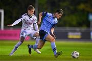 28 April 2023; Donal Higgins of UCD in action against Paddy Kirk of Bohemians during the SSE Airtricity Men's Premier Division match between UCD and Bohemians at the UCD Bowl in Dublin. Photo by Ben McShane/Sportsfile