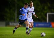 28 April 2023; Michael Gallagher of UCD in action against Kris Twardek of Bohemians during the SSE Airtricity Men's Premier Division match between UCD and Bohemians at the UCD Bowl in Dublin. Photo by Ben McShane/Sportsfile