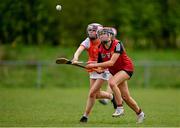 29 April 2023; Lena Mason of Down in action against Erin Murphy of Armagh during the Electric Ireland Camogie Minor C All-Ireland Championship Semi-Final match between Armagh and Down at Templeport St. Aidan’s in Corrasmongan, Cavan. Photo by Stephen Marken/Sportsfile