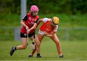 29 April 2023; Orlaith Sharkey of Down in action against Grace Fitzpatrick of Armagh during the Electric Ireland Camogie Minor C All-Ireland Championship Semi-Final match between Armagh and Down at Templeport St. Aidan’s in Corrasmongan, Cavan. Photo by Stephen Marken/Sportsfile