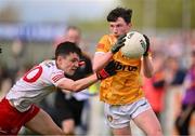 29 April 2023; Conor Johnston of Antrim in action against Darragh Donaghy of Tyrone during the Ulster GAA Minor Football Championship Group B match between Tyrone and Antrim at O’Neills Healy Park in Omagh, Tyrone. Photo by Ben McShane/Sportsfile