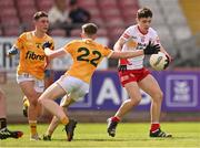 29 April 2023; Darragh Donaghy of Tyrone in action against Jack Harney of Antrim during the Ulster GAA Minor Football Championship Group B match between Tyrone and Antrim at O’Neills Healy Park in Omagh, Tyrone. Photo by Ben McShane/Sportsfile