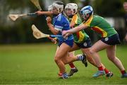 29 April 2023; Aoife Daly of Laois in action against Roisin Carroll, left, and Eimear Raleigh of Carlow during the Electric Ireland Camogie Minor B All-Ireland Championship Semi-Final match between Carlow and Laois at Banagher in Offaly. Photo by Tom Beary/Sportsfile