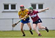 29 April 2023; Sarah Downes of Westmeath in action against Hazel Kelly of Roscommon during the Electric Ireland Camogie Minor B All-Ireland Championship Semi Final match between Roscommon and Westmeath at Templeport St. Aidan’s in Corrasmongan, Cavan. Photo by Stephen Marken/Sportsfile