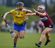 29 April 2023; Lilly Murray of Roscommon in action against Clare Gaffney of Westmeath during the Electric Ireland Camogie Minor B All-Ireland Championship Semi Final match between Roscommon and Westmeath at Templeport St. Aidan’s in Corrasmongan, Cavan. Photo by Stephen Marken/Sportsfile
