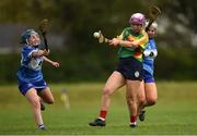 29 April 2023; Holly Wall Murphy of Carlow in action against Eimear Hassett, left, Aoife Daly of Laois  and during the Electric Ireland Camogie Minor B All-Ireland Championship Semi-Final match between Carlow and Laois at Banagher in Offaly. Photo by Tom Beary/Sportsfile