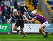 29 April 2023; Antrim goalkeeper Ryan Elliott in action against Rory O'Connor of Wexford during the Leinster GAA Hurling Senior Championship Round 2 match between Wexford and Antrim at Chadwicks Wexford Park in Wexford. Photo by Tyler Miller/Sportsfile