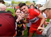29 April 2023; Conor Doherty of Derry with supporters after the Ulster GAA Football Senior Championship Semi Final match between Derry and Monaghan at O’Neills Healy Park in Omagh, Tyrone. Photo by Ben McShane/Sportsfile