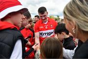 29 April 2023; Gareth McKinless of Derry with supporters after the Ulster GAA Football Senior Championship Semi Final match between Derry and Monaghan at O’Neills Healy Park in Omagh, Tyrone. Photo by Ben McShane/Sportsfile