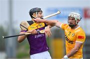 29 April 2023; Paddy Burke of Antrim pushes away Jack O'Connor of Wexford with his hurley during the Leinster GAA Hurling Senior Championship Round 2 match between Wexford and Antrim at Chadwicks Wexford Park in Wexford. Photo by Tyler Miller/Sportsfile