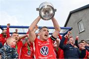 29 April 2023; Newmarket Celtic captain Eoin Hayes lifts the torphy after his side's victory in the FAI Junior Cup Final match between St Michael’s AFC and Newmarket Celtic at Jackman Park in Limerick. Photo by Seb Daly/Sportsfile