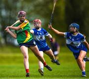 29 April 2023; Niamh Cox of Carlow in action against Kaylah O'Meara, left, and Kaylee O'Keefe of Laois during the Electric Ireland Camogie Minor B All-Ireland Championship Semi-Final match between Carlow and Laois at Banagher in Offaly. Photo by Tom Beary/Sportsfile
