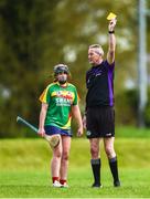 29 April 2023; Referee Eamon Cassidy shows a yellow card to Sarah Joyce of Carlow during the Electric Ireland Camogie Minor B All-Ireland Championship Semi-Final match between Carlow and Laois at Banagher in Offaly. Photo by Tom Beary/Sportsfile
