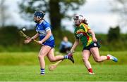29 April 2023; Tara Lowry of Laois in action against Aislinn Joyce of Carlow during the Electric Ireland Camogie Minor B All-Ireland Championship Semi-Final match between Carlow and Laois at Banagher in Offaly. Photo by Tom Beary/Sportsfile