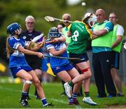 29 April 2023; Sarah Sheehan of Carlow in action against Tara Lowry of Laois during the Electric Ireland Camogie Minor B All-Ireland Championship Semi-Final match between Carlow and Laois at Banagher in Offaly. Photo by Tom Beary/Sportsfile
