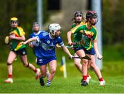 29 April 2023; Caoilfhionn Lawler of Carlow in action against Aoife Gee of Laois during the Electric Ireland Camogie Minor B All-Ireland Championship Semi-Final match between Carlow and Laois at Banagher in Offaly. Photo by Tom Beary/Sportsfile