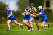 29 April 2023; Sarah Joyce of Carlow in action against Annabelle Ryan, left, and Aoife Gee of Laois during the Electric Ireland Camogie Minor B All-Ireland Championship Semi-Final match between Carlow and Laois at Banagher in Offaly. Photo by Tom Beary/Sportsfile