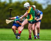 29 April 2023; Leah Ryan of Carlow in action against Aoife Daly, left, and Tara Lowry of Laois during the Electric Ireland Camogie Minor B All-Ireland Championship Semi-Final match between Carlow and Laois at Banagher in Offaly. Photo by Tom Beary/Sportsfile