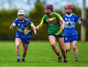 29 April 2023; Aoife Gee of Laois in action against Niamh Cox of Carlow during the Electric Ireland Camogie Minor B All-Ireland Championship Semi-Final match between Carlow and Laois at Banagher in Offaly. Photo by Tom Beary/Sportsfile