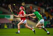 28 April 2023; Tadhg O'Connell of Cork in action against Barry Duff of Limerick during the oneills.com Munster GAA Hurling U20 Championship Round 5 match between Limerick and Cork at TUS Gaelic Grounds in Limerick. Photo by Stephen Marken/Sportsfile