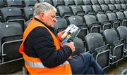 30 April 2023; Maor Pat Gunner, Conahy Shamrocks GAA Club, reads his programme, before the grounds open, ahead of the Leinster GAA Hurling Senior Championship Round 2 match between Kilkenny and Galway at UPMC Nowlan Park in Kilkenny. Photo by Ray McManus/Sportsfile