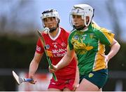 30 April 2023; Gráinne Cassidy of Tyrone in action against Bronagh Butler of Donegal  during the Electric Ireland Camogie Minor C All-Ireland Championship Shield Final match between Donegal and Tyrone at Tír na nÓg Randalstown in Antrim. Photo by Stephen Marken/Sportsfile